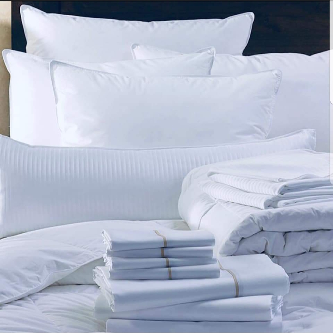 Premium white bed linen and pillows