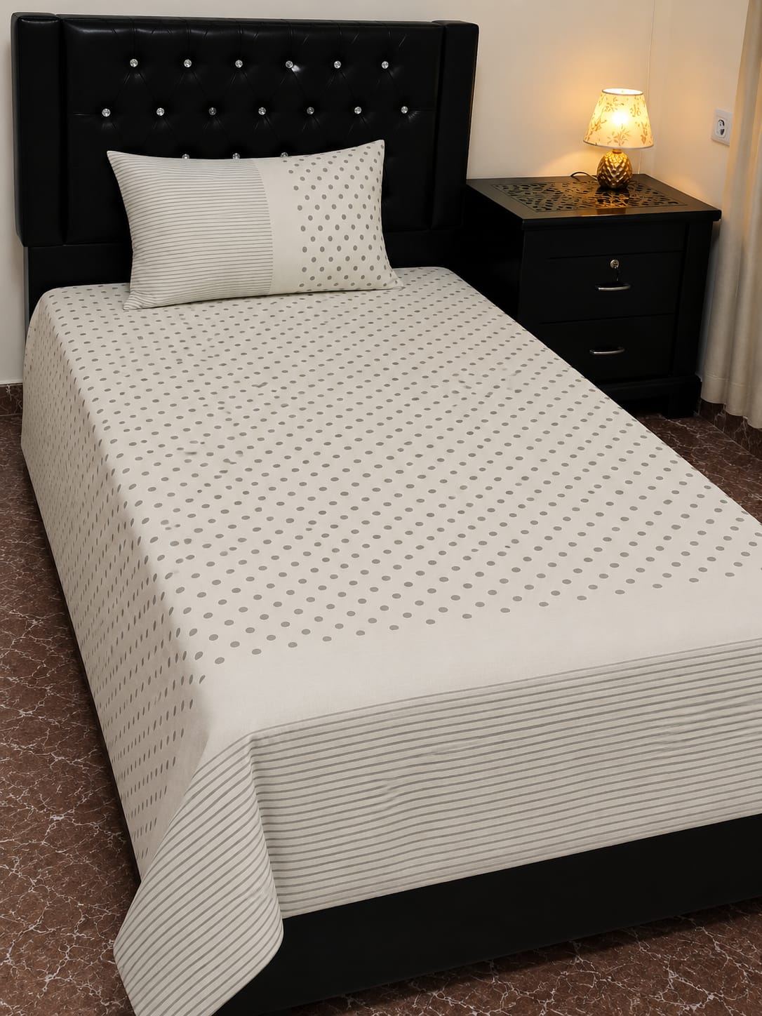 Cream colored patterned bed sheets